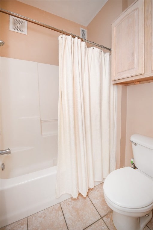 bathroom featuring toilet, shower / bath combination with curtain, and tile patterned floors