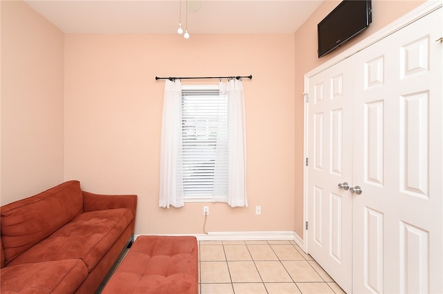 sitting room featuring light tile patterned floors