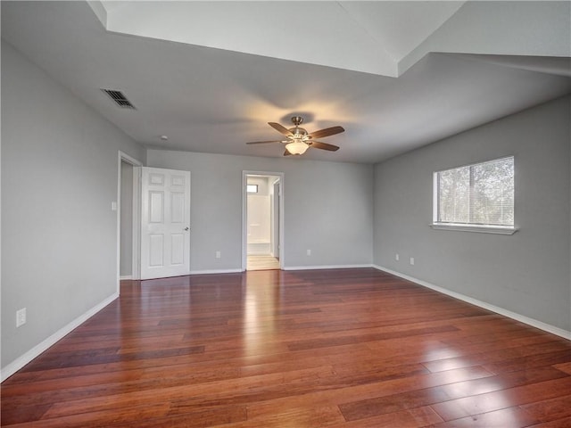 unfurnished room with visible vents, ceiling fan, baseboards, and wood finished floors