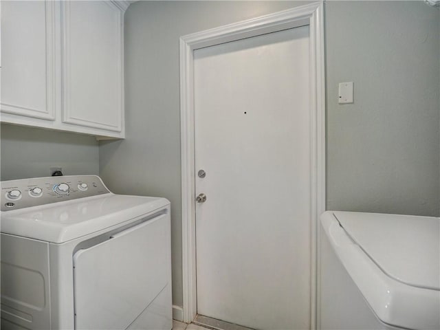 laundry room featuring cabinet space and washer and dryer