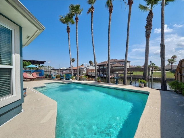 14218 Punta Bonaire Dr, Corpus Christi, TX 78418 - outdoor pool featuring a patio, a water view, and a residential view