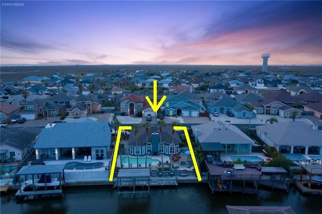 14218 Punta Bonaire Dr, Corpus Christi, TX 78418 - aerial view at dusk of a residential view, property boundaries highlighted, and a water view