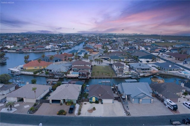 14218 Punta Bonaire Dr, Corpus Christi, TX 78418 - aerial view at dusk of a residential view and a water view