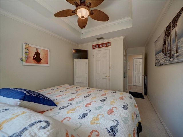 14218 Punta Bonaire Dr, Corpus Christi, TX 78418 - bedroom featuring a tray ceiling, ornamental molding, carpet floors, and ceiling fan