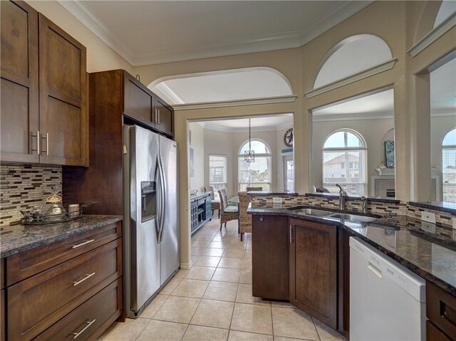14218 Punta Bonaire Dr, Corpus Christi, TX 78418 - kitchen featuring stainless steel fridge with ice dispenser, white dishwasher, crown molding, tasteful backsplash, and dark stone countertops