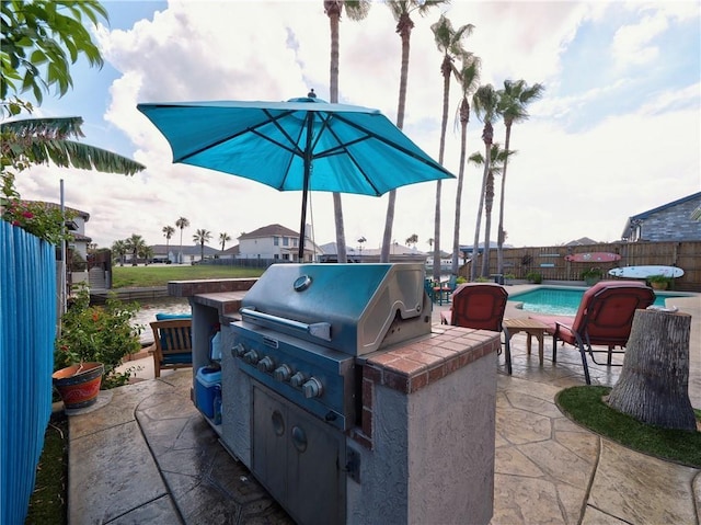 14218 Punta Bonaire Dr, Corpus Christi, TX 78418 - fenced backyard with a patio and area for grilling