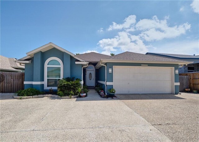 14218 Punta Bonaire Dr, Corpus Christi, TX 78418 - ranch-style home featuring stucco siding, concrete driveway, and a garage