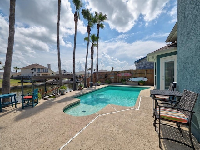 14218 Punta Bonaire Dr, Corpus Christi, TX 78418 - view of pool with a patio, a fenced backyard, and a water view