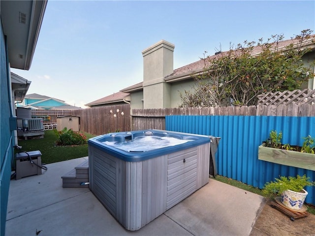 14218 Punta Bonaire Dr, Corpus Christi, TX 78418 - view of patio / terrace with a hot tub