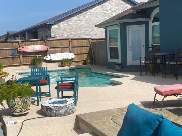 14218 Punta Bonaire Dr, Corpus Christi, TX 78418 - view of pool with a patio, a fire pit, and grilling area