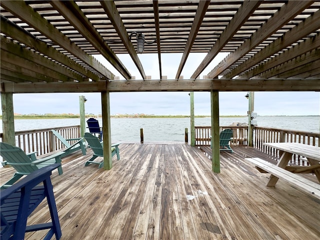 view of dock featuring a water view and a pergola