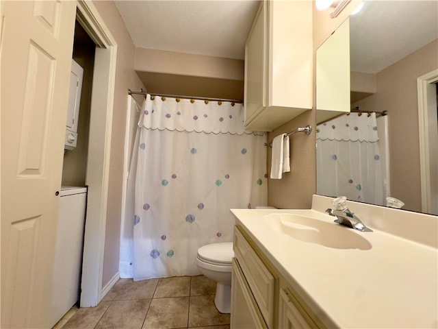 full bathroom featuring shower / bath combo, tile patterned floors, stacked washer / dryer, toilet, and vanity