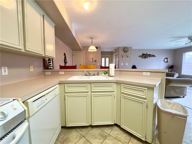 kitchen featuring sink, hanging light fixtures, kitchen peninsula, white appliances, and light tile patterned floors