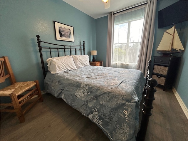 bedroom featuring wood-type flooring and ceiling fan