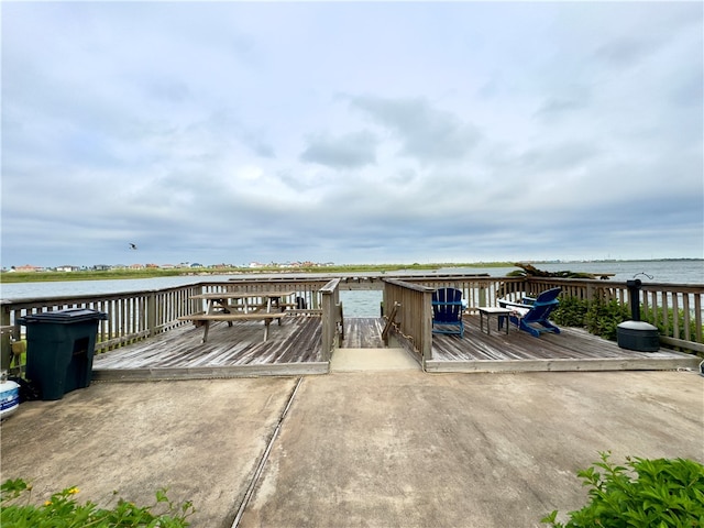 wooden terrace with a water view