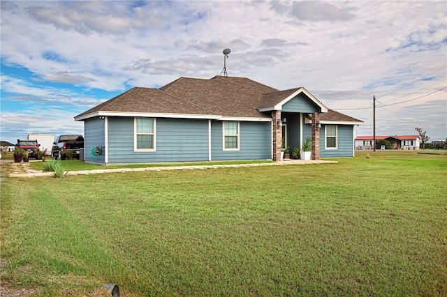 ranch-style home featuring a front yard