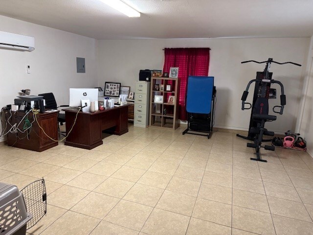1002 Blue Crest Ln, Beeville, TX 78102 - office with a wall mounted AC and electric panel