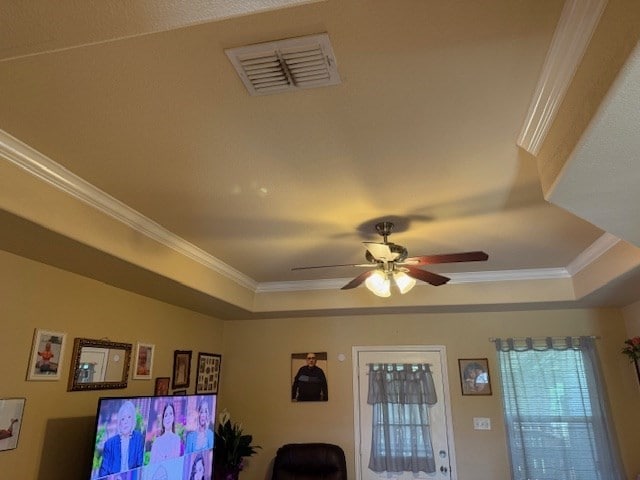 1002 Blue Crest Ln, Beeville, TX 78102 - detailed view of a raised ceiling, a ceiling fan, and ornamental molding