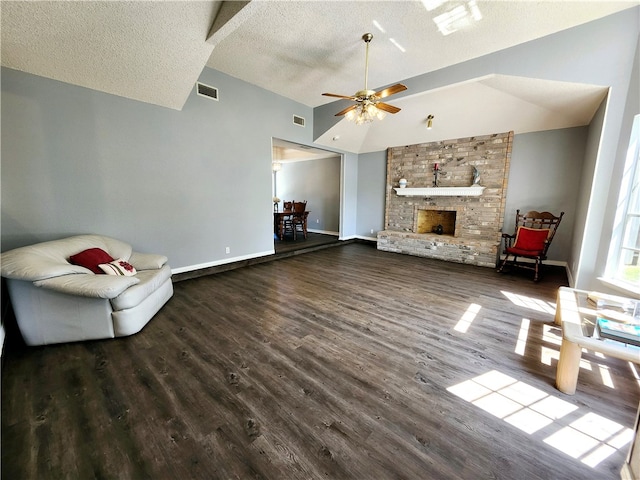 unfurnished living room with ceiling fan, a textured ceiling, and dark hardwood / wood-style flooring