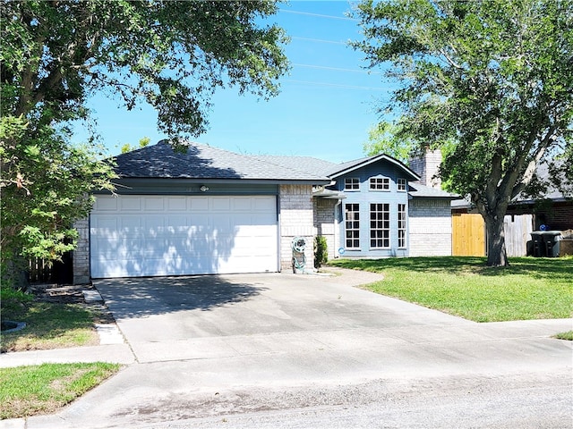 single story home with a garage and a front lawn