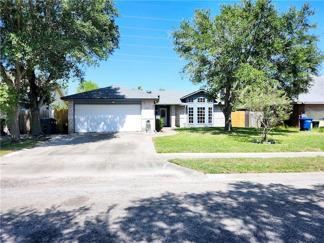 ranch-style house with a garage and a front lawn