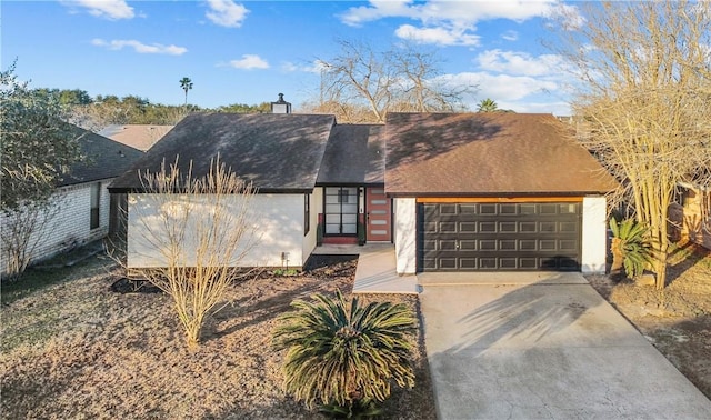 view of front facade with an attached garage and concrete driveway