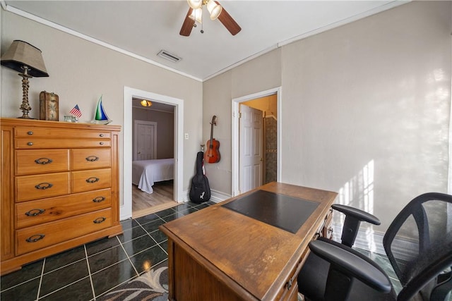 tiled office space featuring ceiling fan and ornamental molding