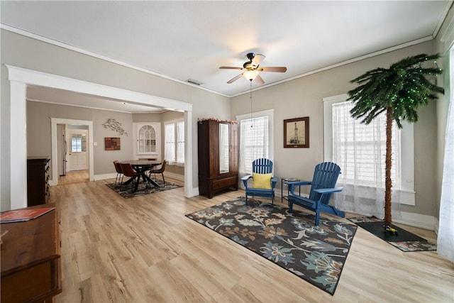 sitting room featuring ceiling fan, light hardwood / wood-style flooring, and ornamental molding