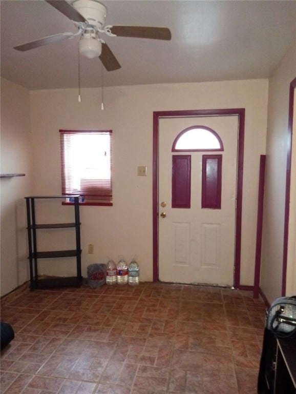 entrance foyer with ceiling fan