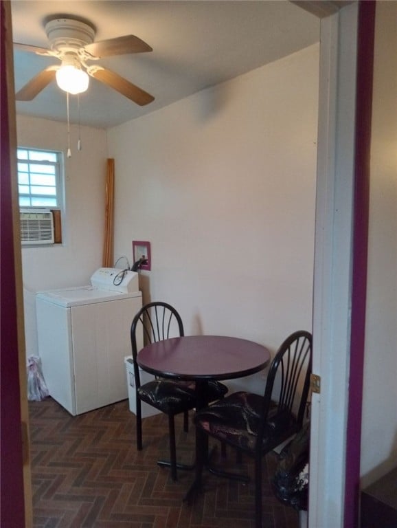 dining space featuring ceiling fan and washer / clothes dryer