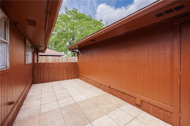 view of patio / terrace featuring fence
