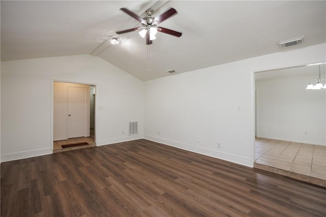 unfurnished room featuring vaulted ceiling, visible vents, wood finished floors, and ceiling fan with notable chandelier