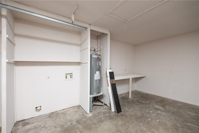 clothes washing area featuring laundry area, washer hookup, and electric water heater