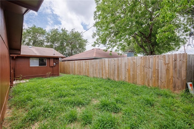view of yard with a fenced backyard