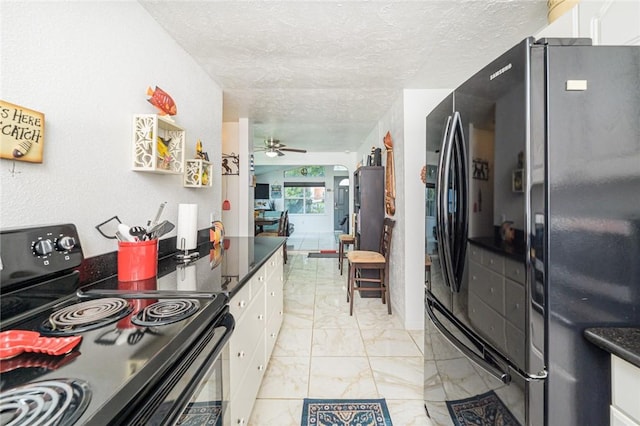 kitchen with black appliances, white cabinets, light marble finish flooring, a textured ceiling, and ceiling fan
