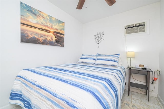 bedroom featuring baseboards, a wall mounted AC, ceiling fan, and marble finish floors