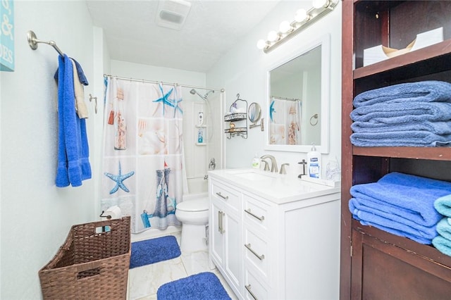 bathroom featuring vanity, toilet, and shower / bath combo