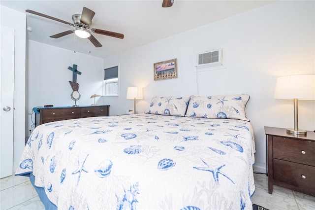 bedroom featuring marble finish flooring, a ceiling fan, and a wall unit AC