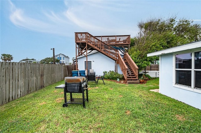 view of yard with stairway and a wooden deck