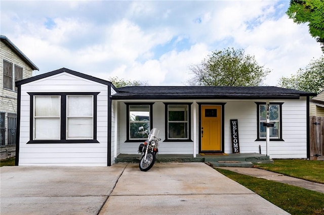 ranch-style home with covered porch