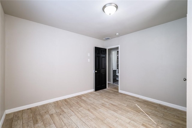 spare room with light hardwood / wood-style floors