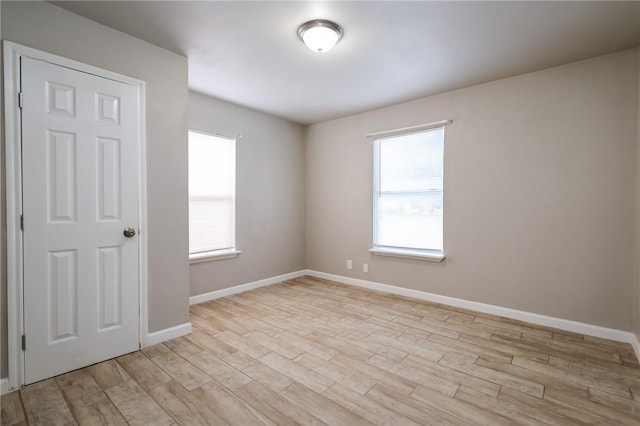 empty room with light wood-type flooring