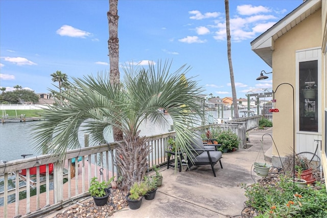 view of patio featuring a water view