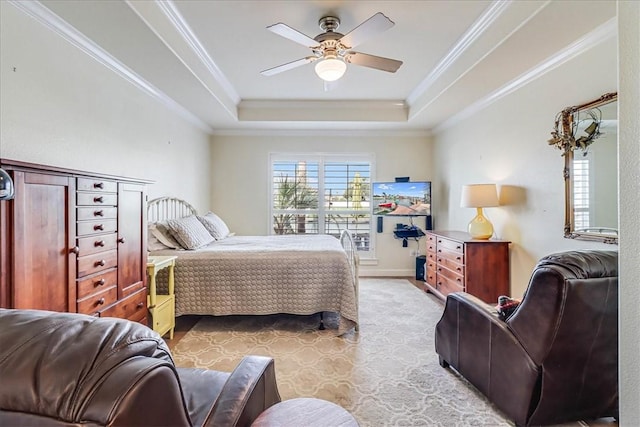 403 Marina Dr, Port Aransas, TX 78373 - bedroom with a raised ceiling, ornamental molding, ceiling fan, and light wood-style flooring