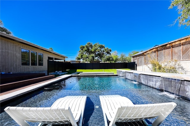 view of swimming pool with pool water feature