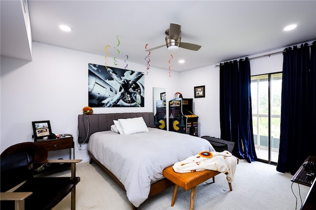 carpeted bedroom featuring access to exterior and ceiling fan