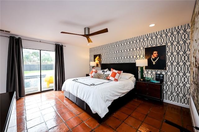 tiled bedroom with ceiling fan and access to outside