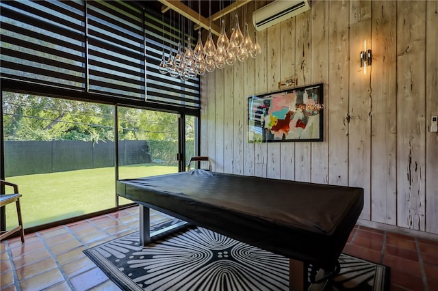 game room featuring a wall unit AC, wooden walls, and billiards