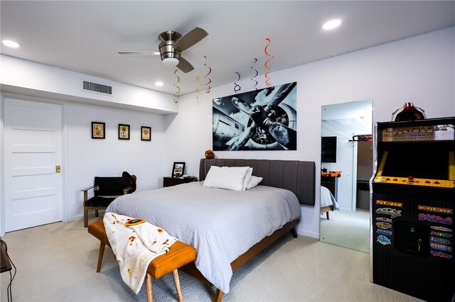 bedroom with light colored carpet and ceiling fan