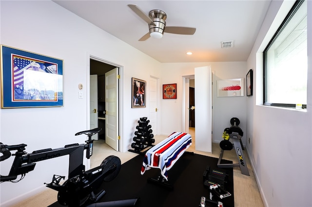 workout area with ceiling fan, light carpet, and lofted ceiling